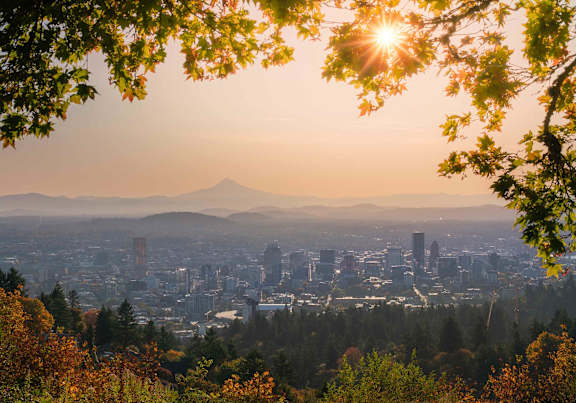 Portland cityscape with mountains at dusk.