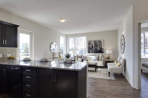 an open floor plan with a kitchen and living room