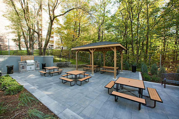 a picnic area with benches and a gazebo