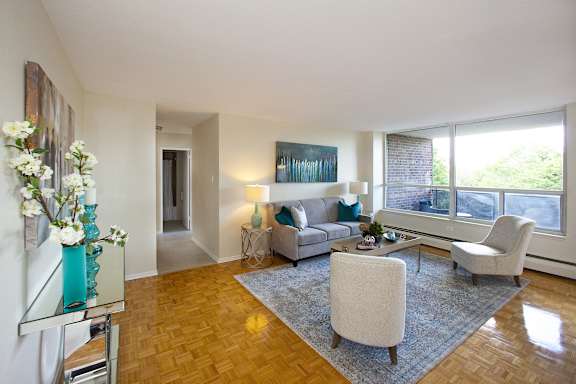 a living room with a couch and two chairs