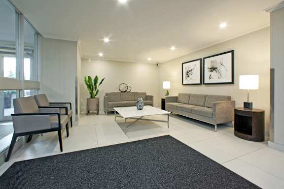 a living room with couches and chairs and a table