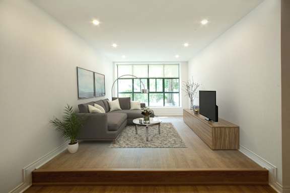 a living room with a couch and a coffee table and a television
