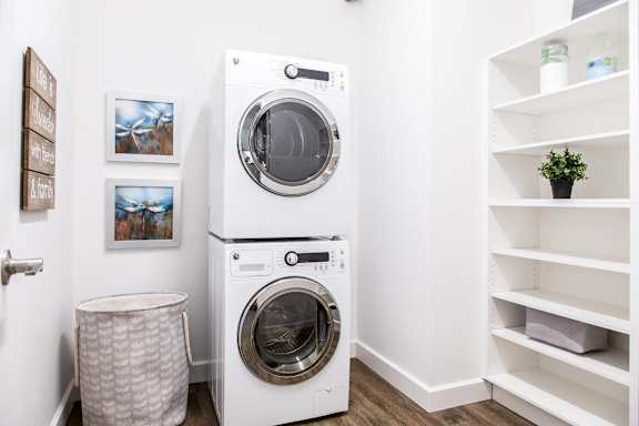 a front loading washer and dryer in a laundry room