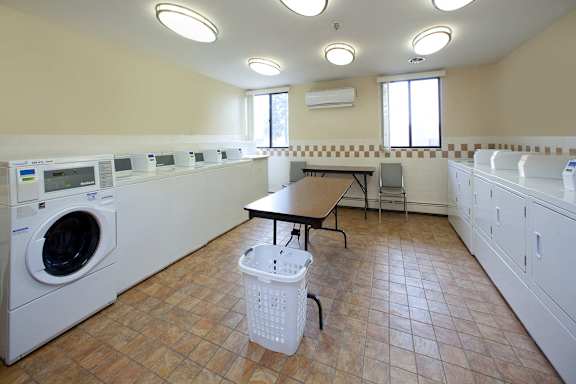 a laundry room with a washing machine and a table