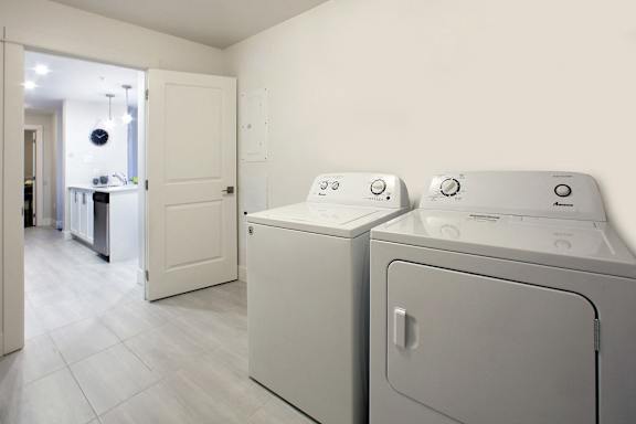 A laundry room with a washer and dryer.