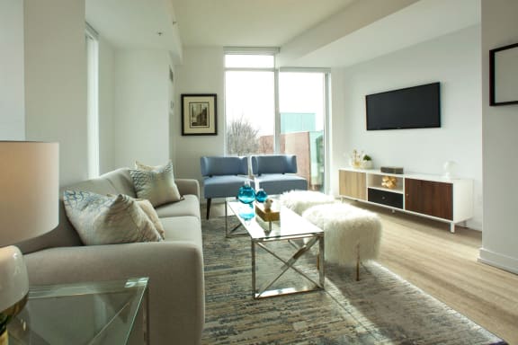 a living room with a couch and a coffee table and a television