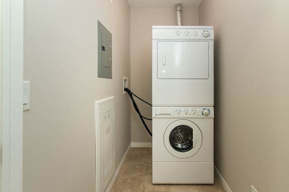 a white washer and dryer in a laundry room