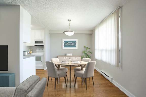 a dining room and kitchen with a table and chairs