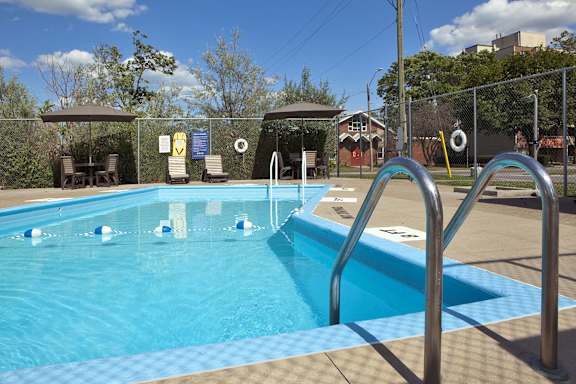 a swimming pool with a fence around it