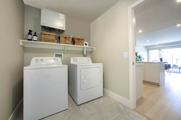 A laundry room with a washer and dryer.