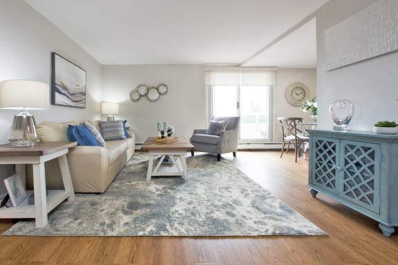 a living room with a couch and a chair and a table