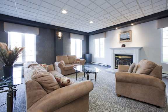 A living room with a fireplace and a couch.