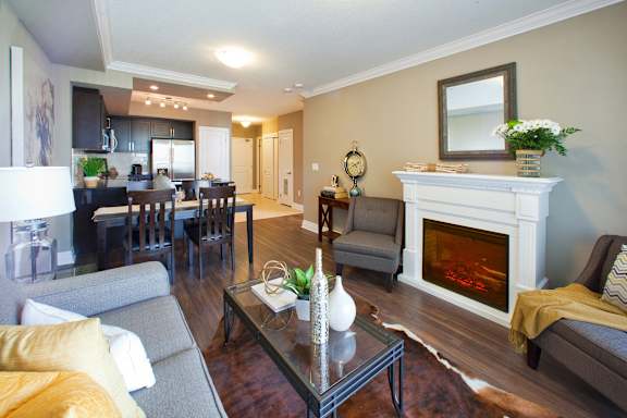 A living room with a fireplace and a couch.
