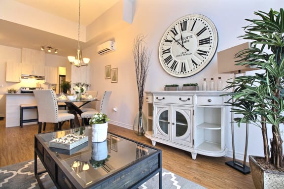 a living room with a large clock on the wall