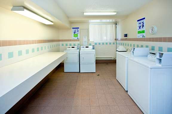 A laundromat with washers and dryers.