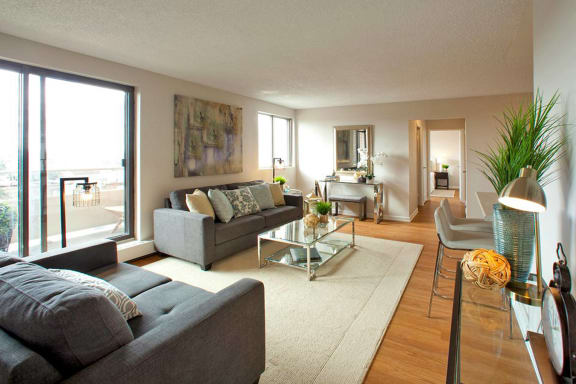 a living room with a couch and a glass table