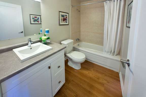 a bathroom with a sink toilet and a bath tub