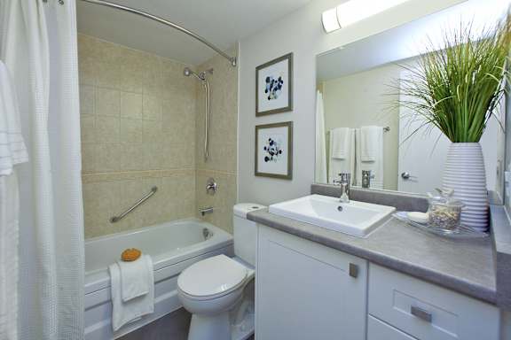 a bathroom with a sink toilet and a tub