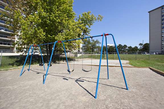 a swing set at a playground in a park