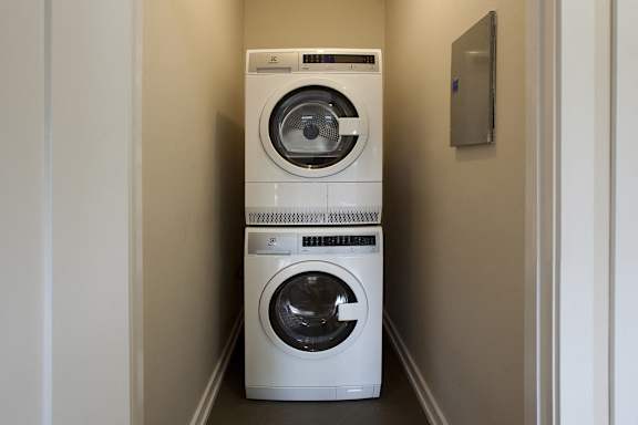 a washing machine and a dryer in a laundry room