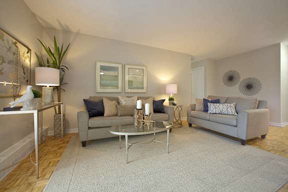 a living room with two couches and a coffee table