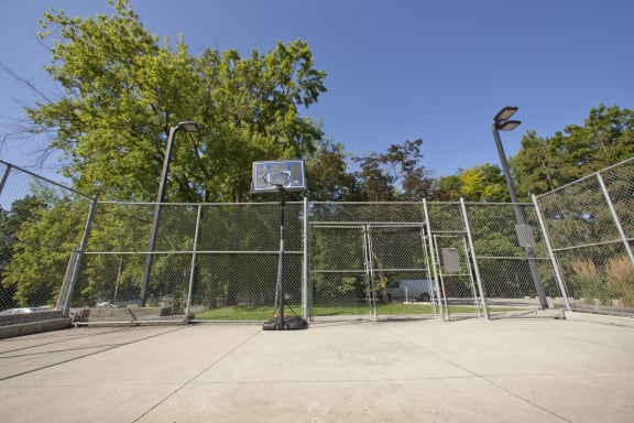 the basketball court at the park is empty