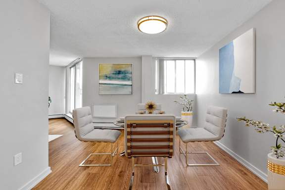 a dining room with a table and chairs
