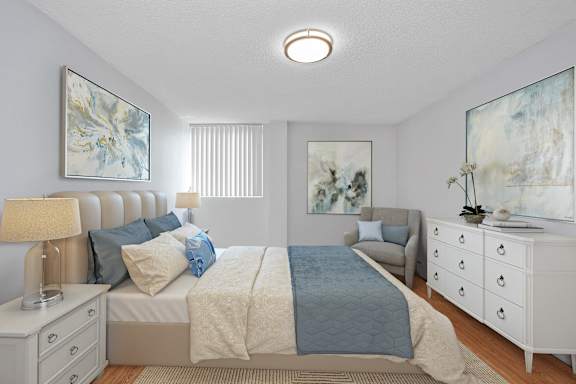 a bedroom with a bed and a chair and a dresser