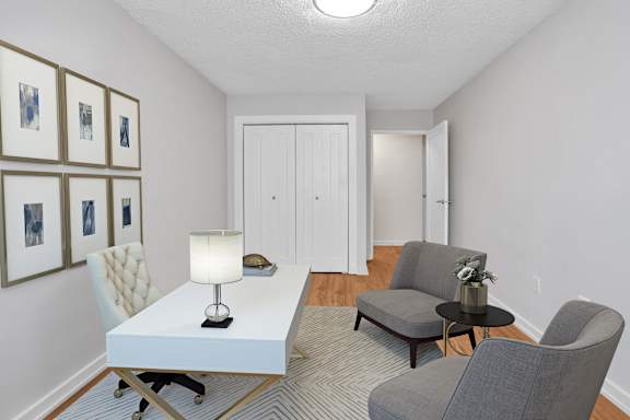 a living room with two couches and a white table