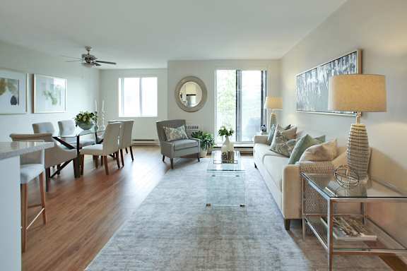 a living room and dining room with a couch and a table