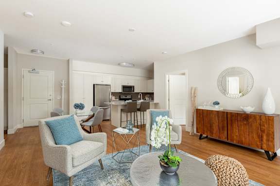 a living room with a dining room and a kitchen