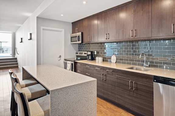a kitchen with a counter top and a sink