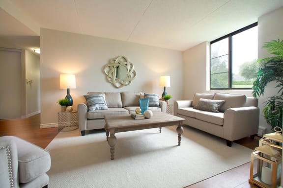 a living room with couches and a coffee table