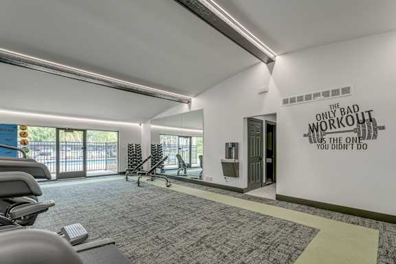 A gym with a sign that says "The only bad workout is the one you didn't do".