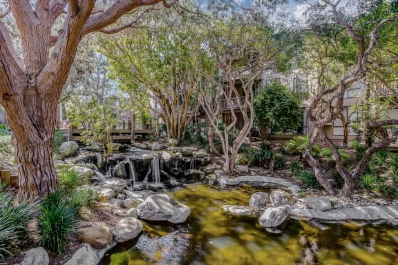 a backyard with a creek and a house  at Mariners Village, Marina del Rey, CA