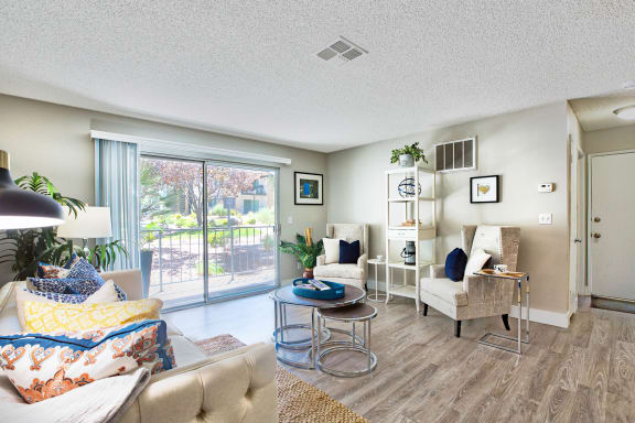 a living room with furniture and a sliding glass door at Mountain Vista, Victorville, 92395