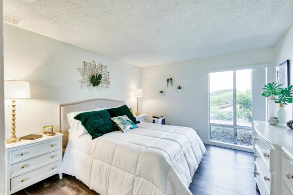 a bedroom with a large bed and a window  at Mediterranean Village Costa Mesa, Costa Mesa, CA, 92626