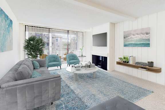 A living room with a grey couch and a blue rug.