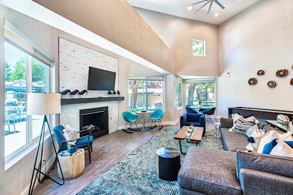 A living room with a fireplace and a television.