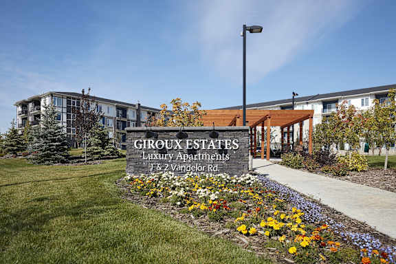 a sign for grook estates in front of a building