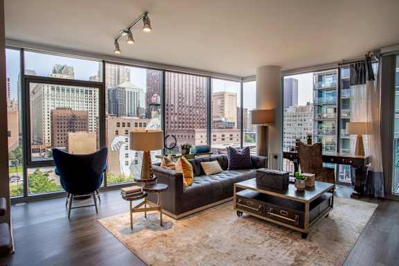 A living room with a view of the city.