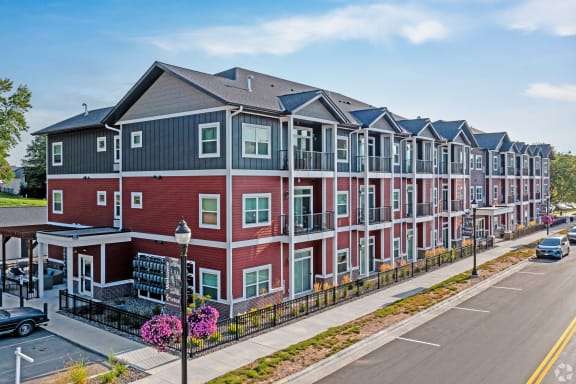 an apartment building on the side of a street