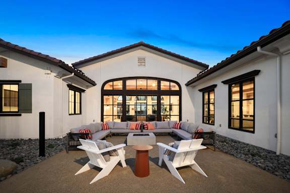 a living room with a couch and chairs in front of a house at Anacapa Canyon, Camarillo, 93012