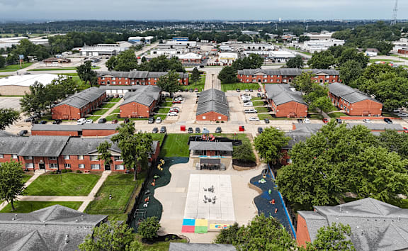 A school campus with a playground in the middle.
