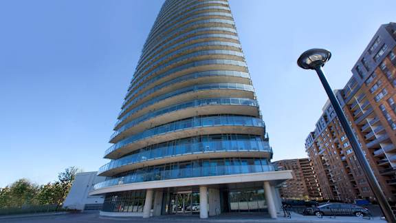 a tall building with a street light in front of it