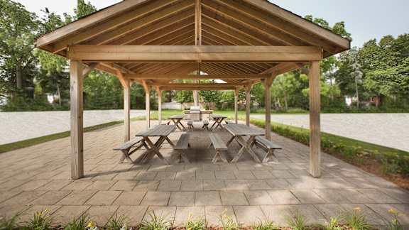 a patio with a picnic table under a pavilion