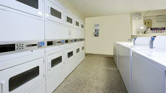 a kitchen with lots of white appliances and counters