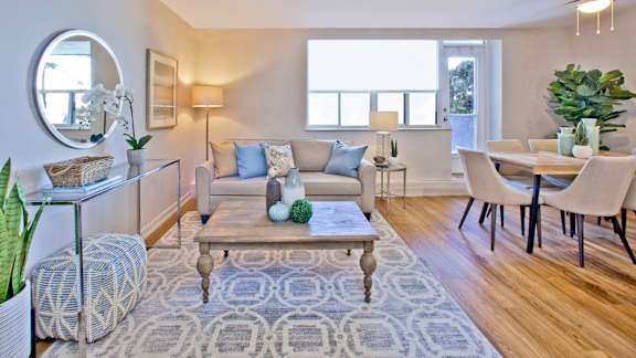 a living room with a couch and a dining room table