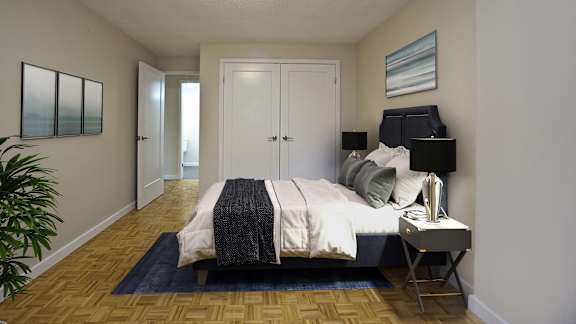 a bedroom with a bed and a nightstand and a closet