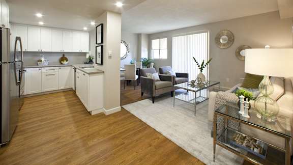 a living room with a kitchen and a dining room